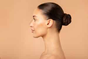 Side profile of woman with smooth tight skin on face and neck from Morpheus8 in Dallas