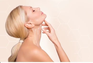 Profile shot of a woman after chin liposuction in Dallas