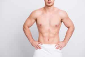 Shirtless man after male tummy tuck in Dallas, TX